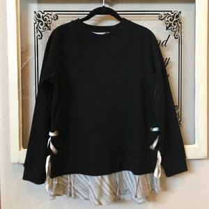 Black sweater with patterned detail